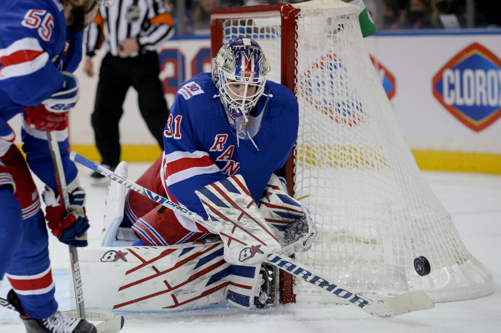 Former New York Rangers goaltender Henrik Lundqvist, center, watches as his  number is retired before an NHL hockey game between the Rangers and the  Minnesota Wild Friday, Jan. 28, 2022 in New